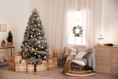 Photo of Beautiful interior of living room with decorated Christmas tree