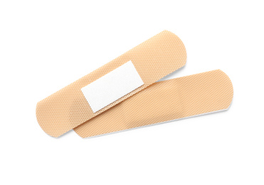 Photo of Medical sticking plasters isolated on white. First aid item