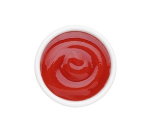 Photo of Bowl of tasty ketchup isolated on white, top view. Tomato sauce