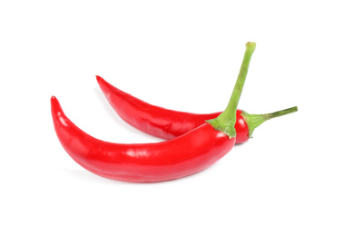 Photo of Ripe red hot chili peppers isolated on white