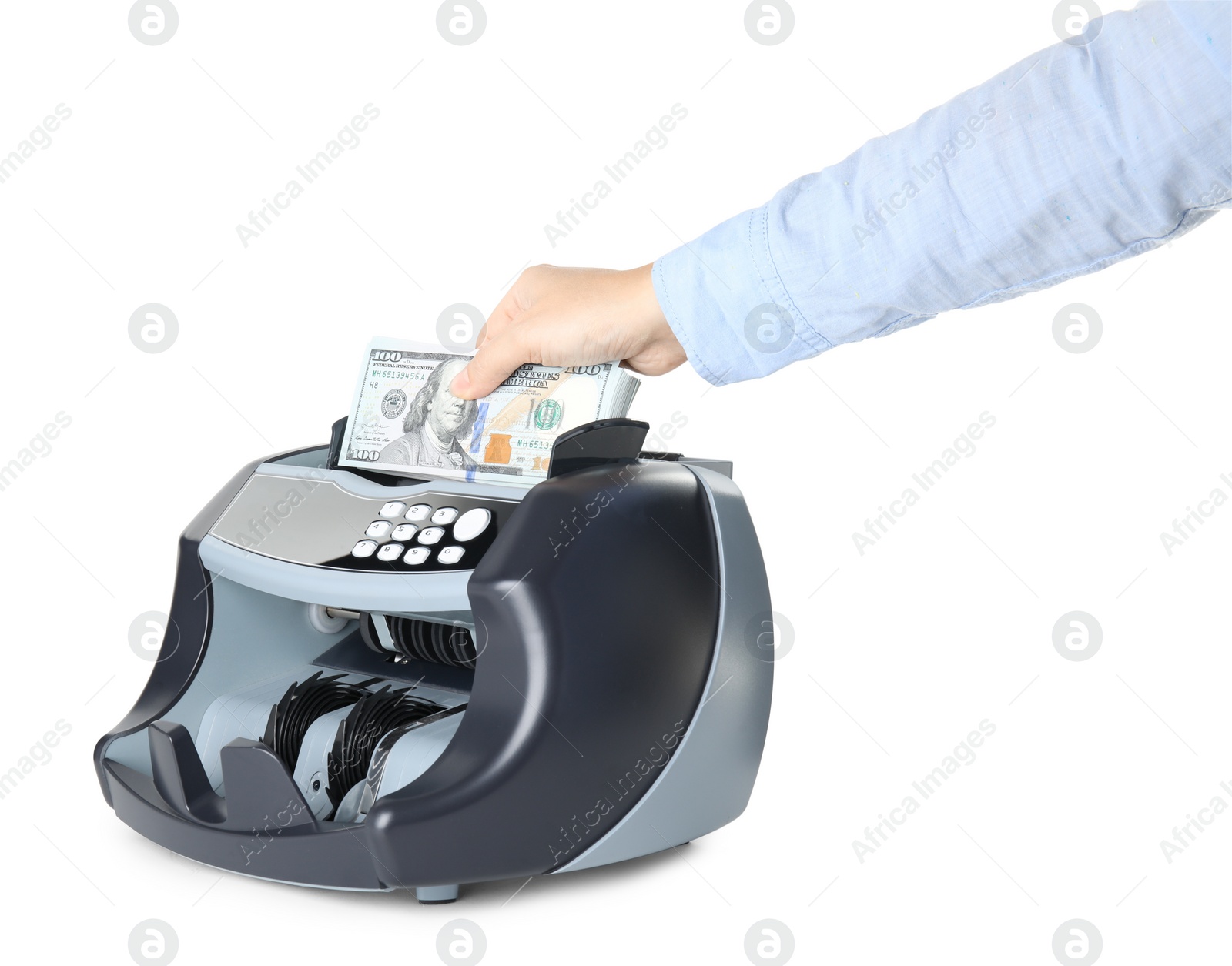 Photo of Woman putting money into counting machine on white background, closeup