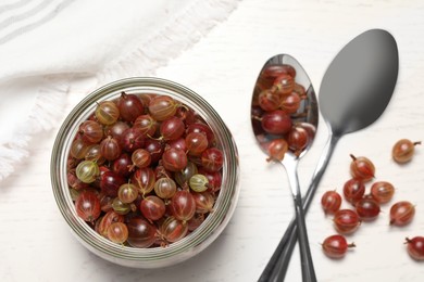 Photo of Many fresh ripe gooseberries on white wooden table, flat lay