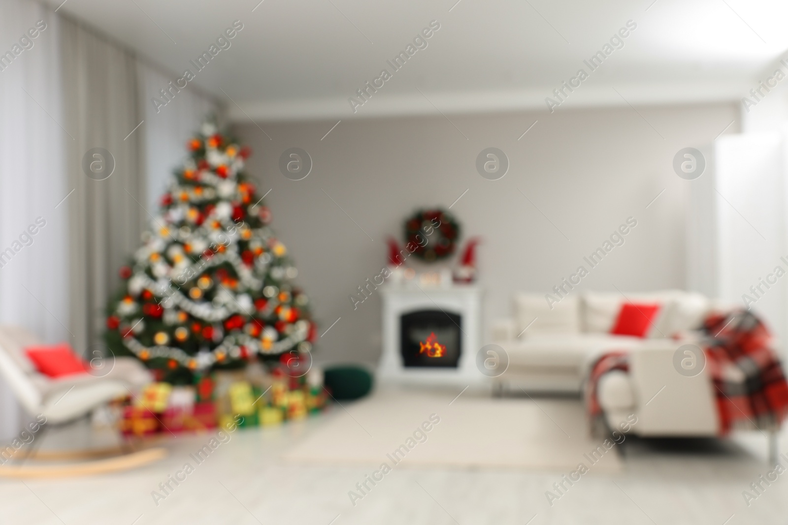 Photo of Blurred view of beautiful Christmas tree in stylish living room interior. Bokeh effect