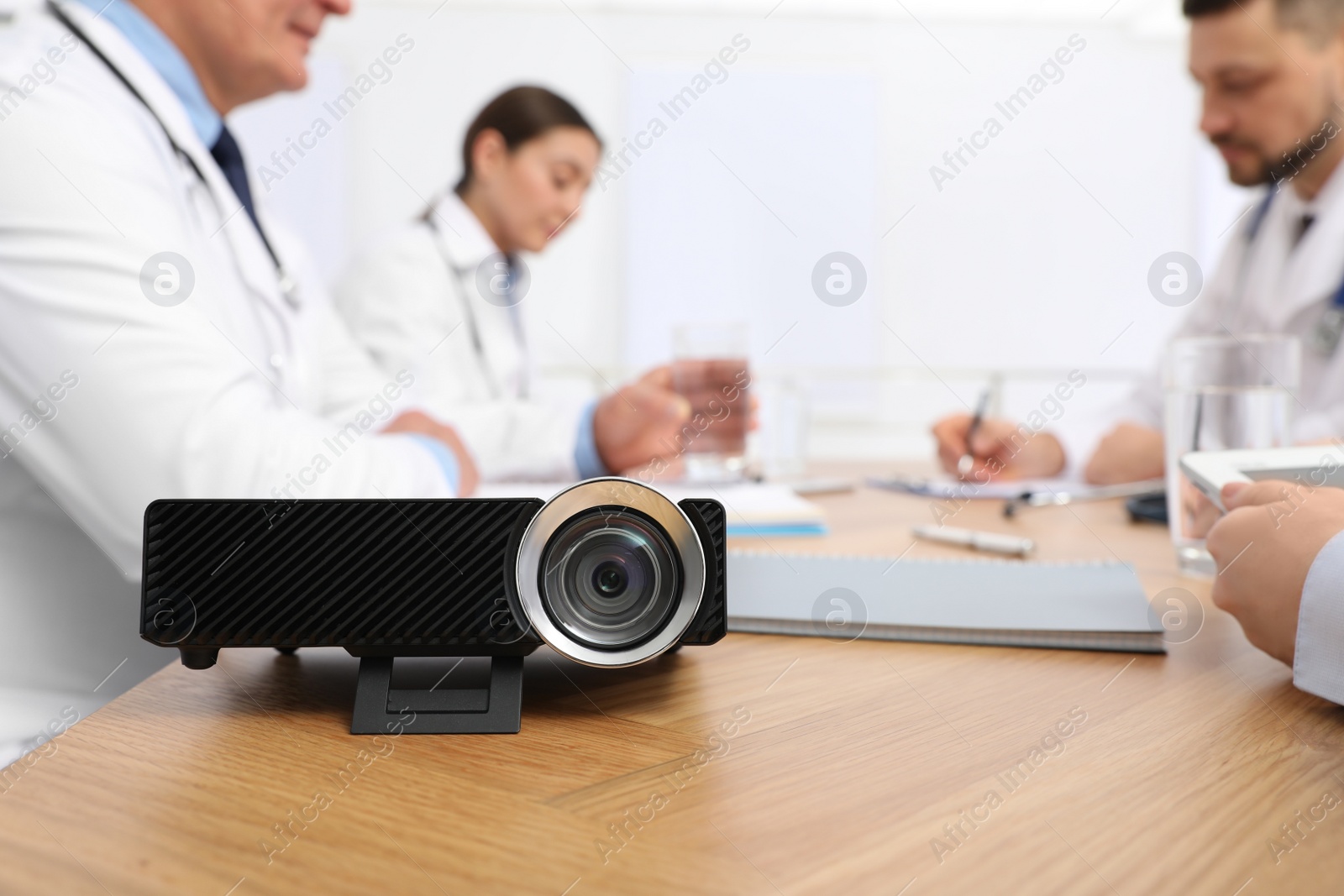 Photo of Video projector on table during medical conference