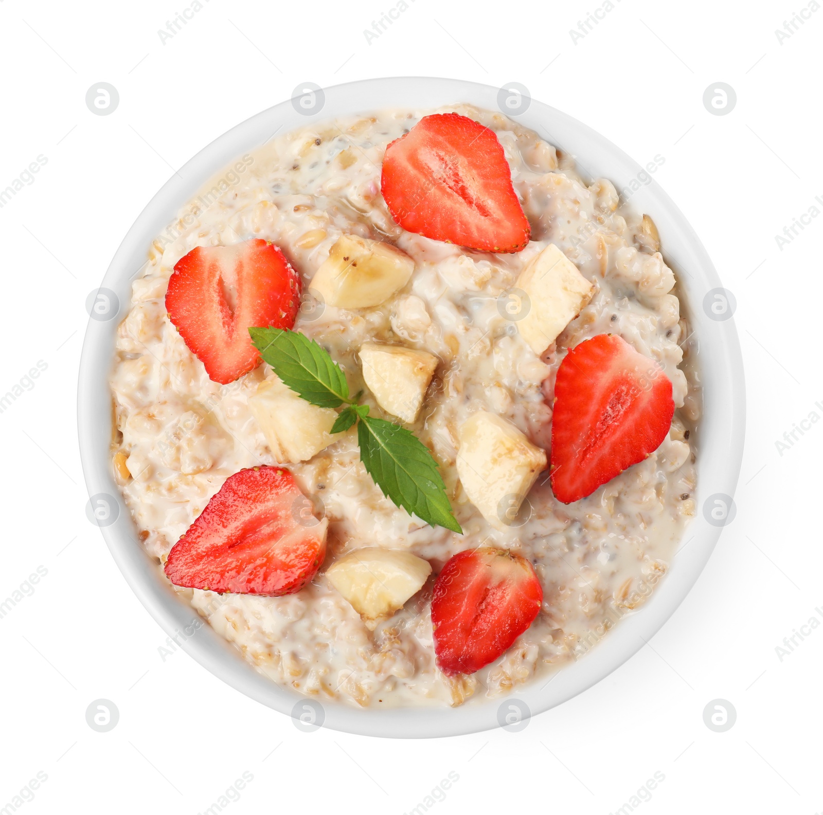 Photo of Tasty boiled oatmeal with strawberries and banana in bowl isolated on white, top view