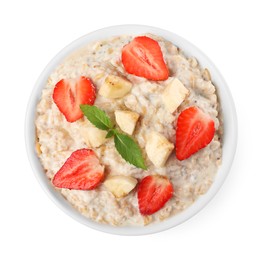 Photo of Tasty boiled oatmeal with strawberries and banana in bowl isolated on white, top view