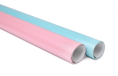 Rolls of colorful wrapping papers on white background