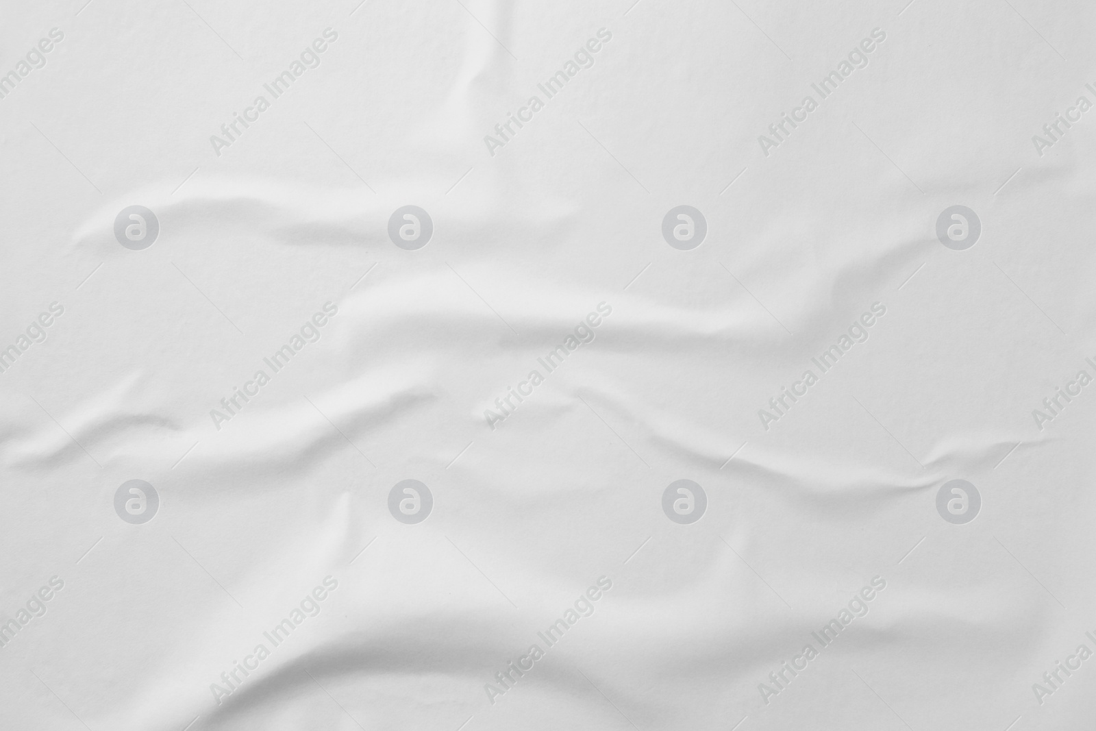 Photo of Texture of white creased paper, closeup view