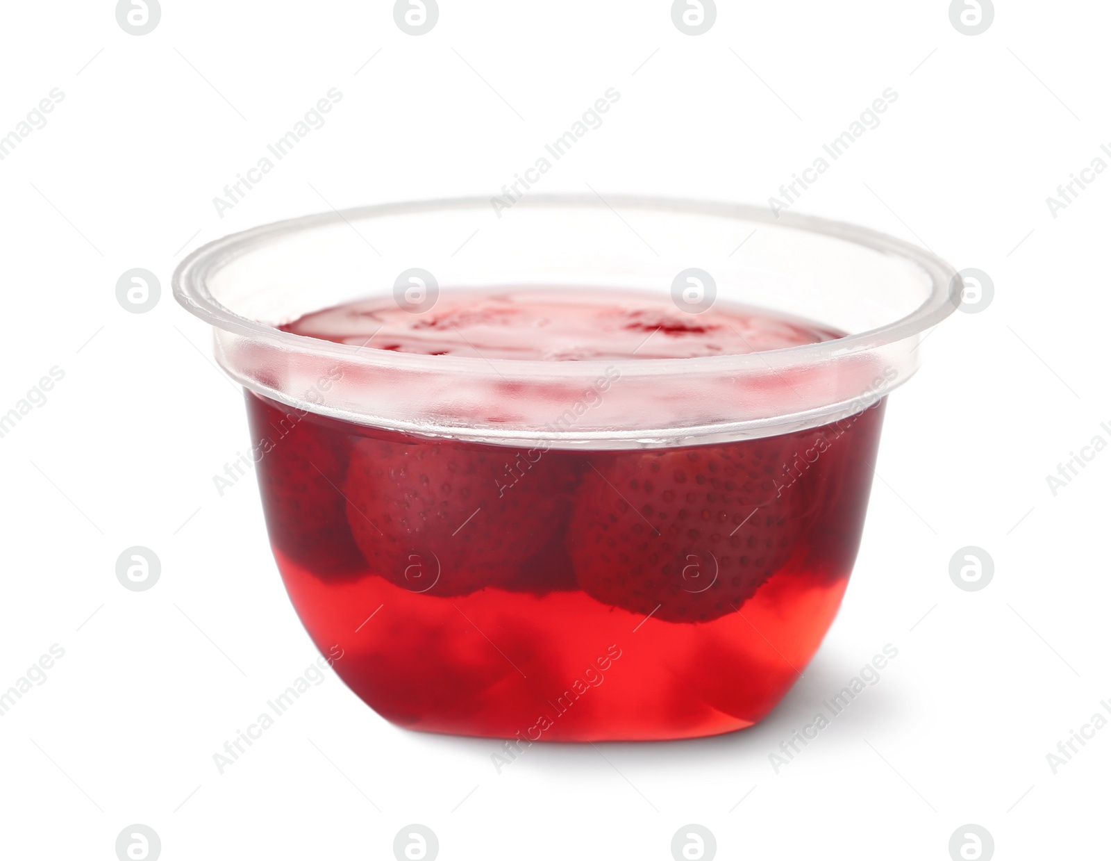 Photo of Tasty jelly dessert with strawberries in plastic cup on white background