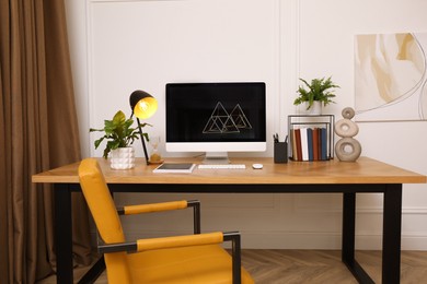 Photo of Room interior with comfortable workplace. Modern computer on wooden desk