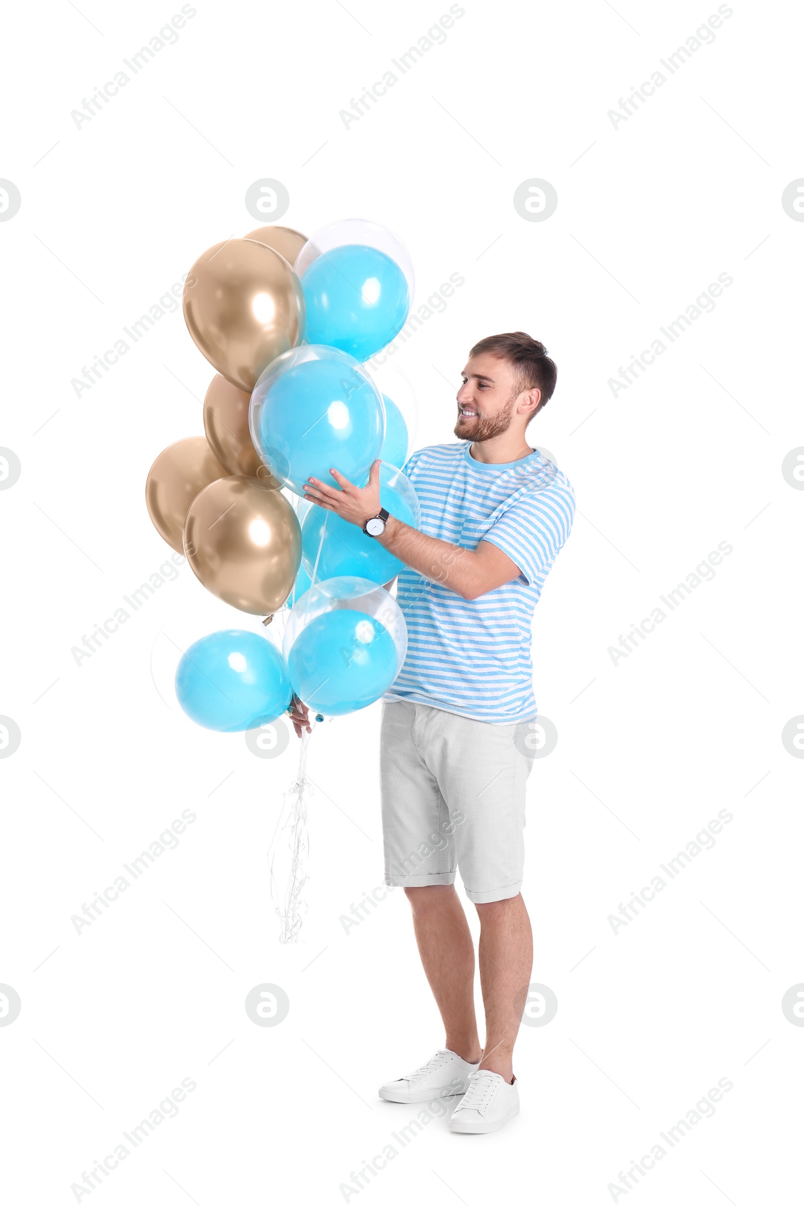 Photo of Young man with air balloons on white background