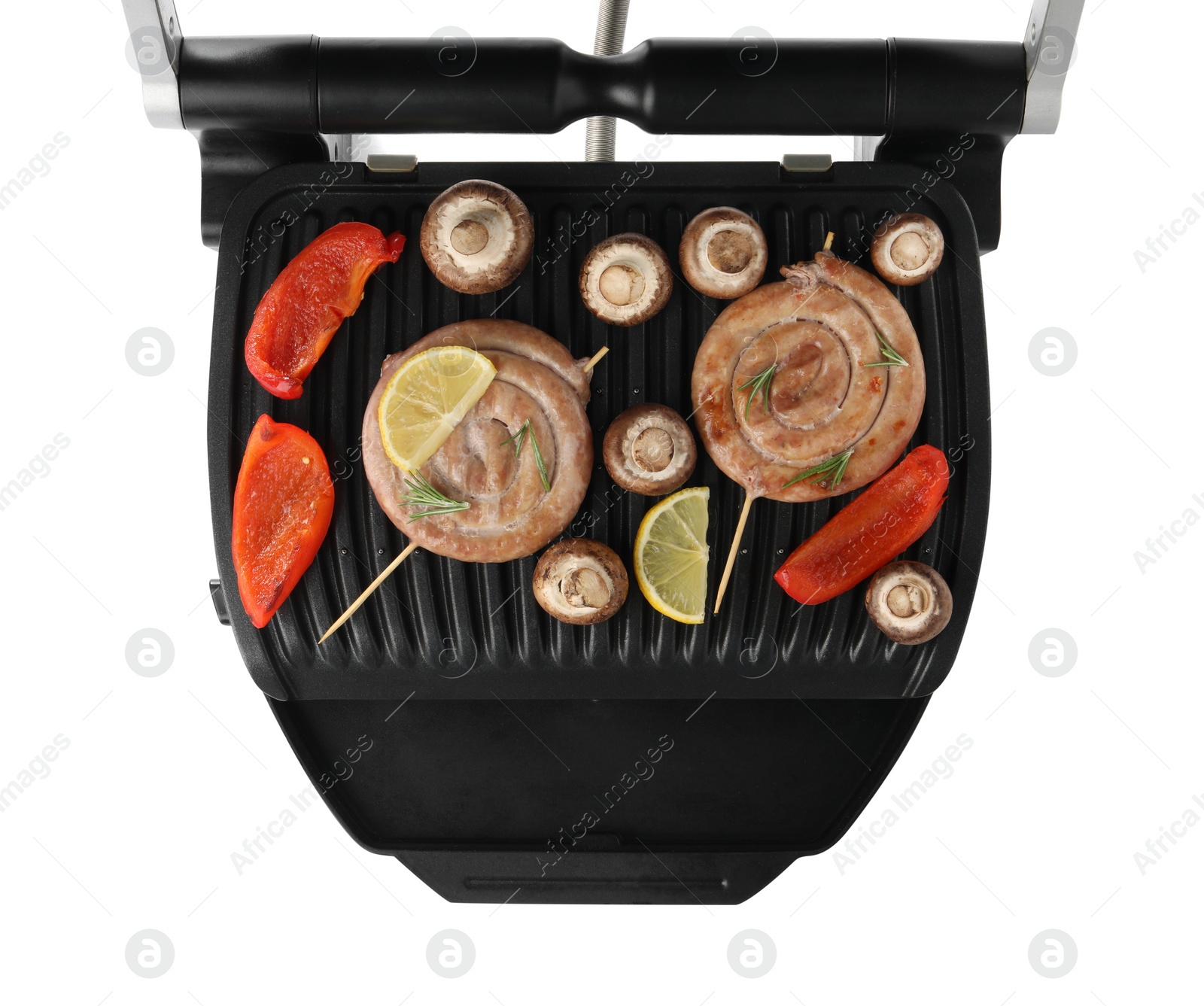 Photo of Electric grill with homemade sausages, mushrooms and bell pepper isolated on white, top view