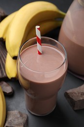 Fresh yummy chocolate milk on black table