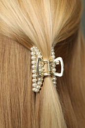 Woman with beautiful hair claw, closeup view