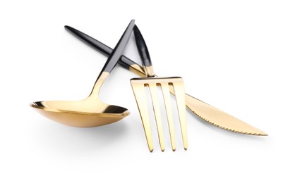 Photo of Shiny golden fork, knife and spoon isolated on white. Luxury cutlery set