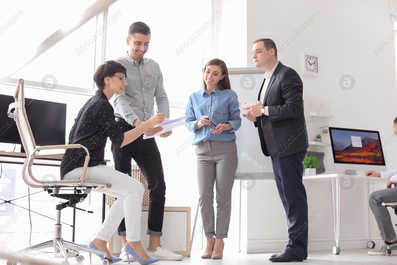 Photo of Young people having business training in office