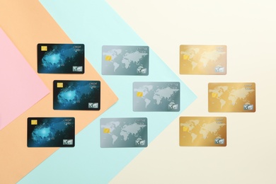 Photo of Flat lay composition with different credit cards on color background