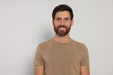 Portrait of handsome bearded man on white background