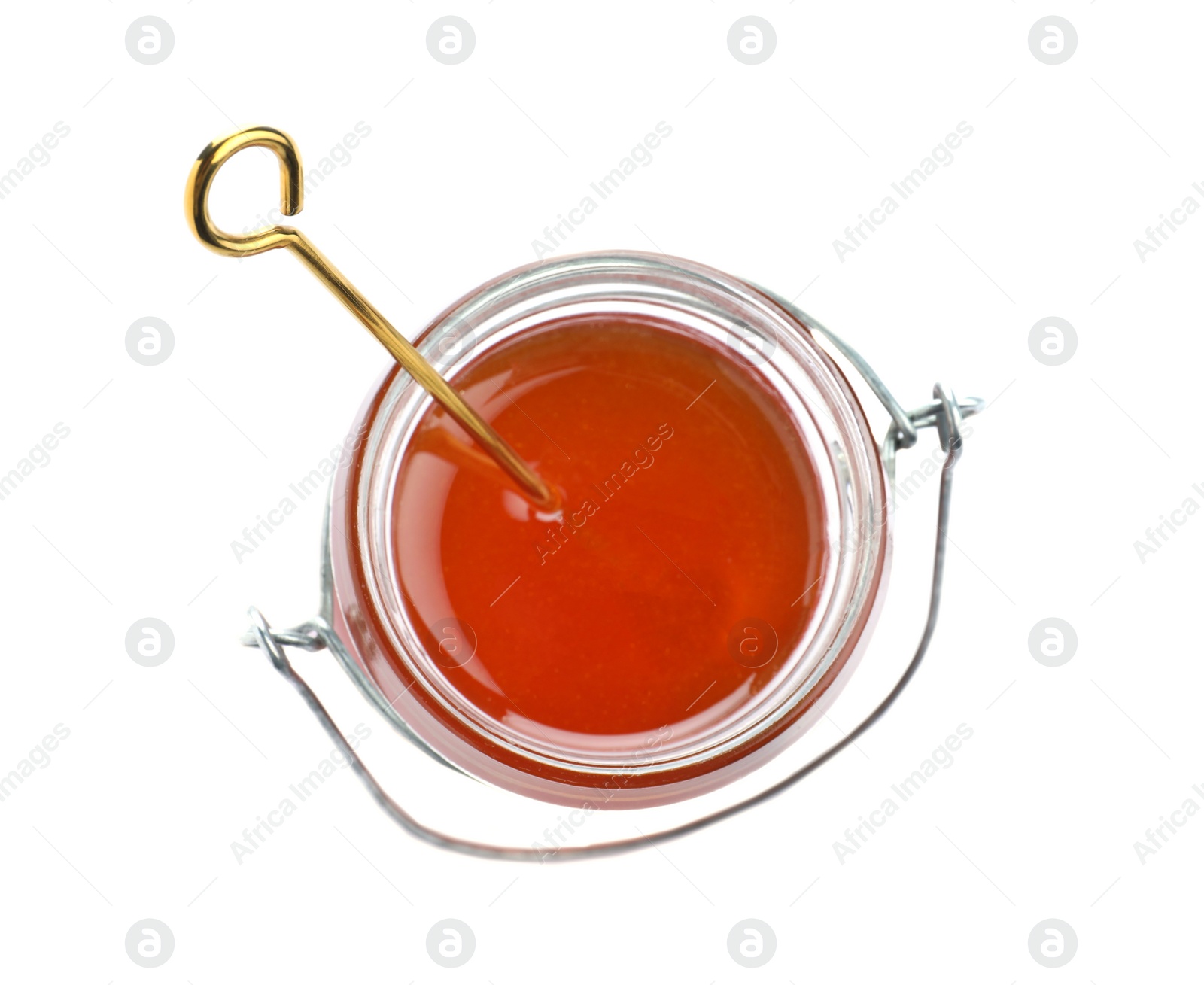 Photo of Jar of organic honey and dipper isolated on white, top view