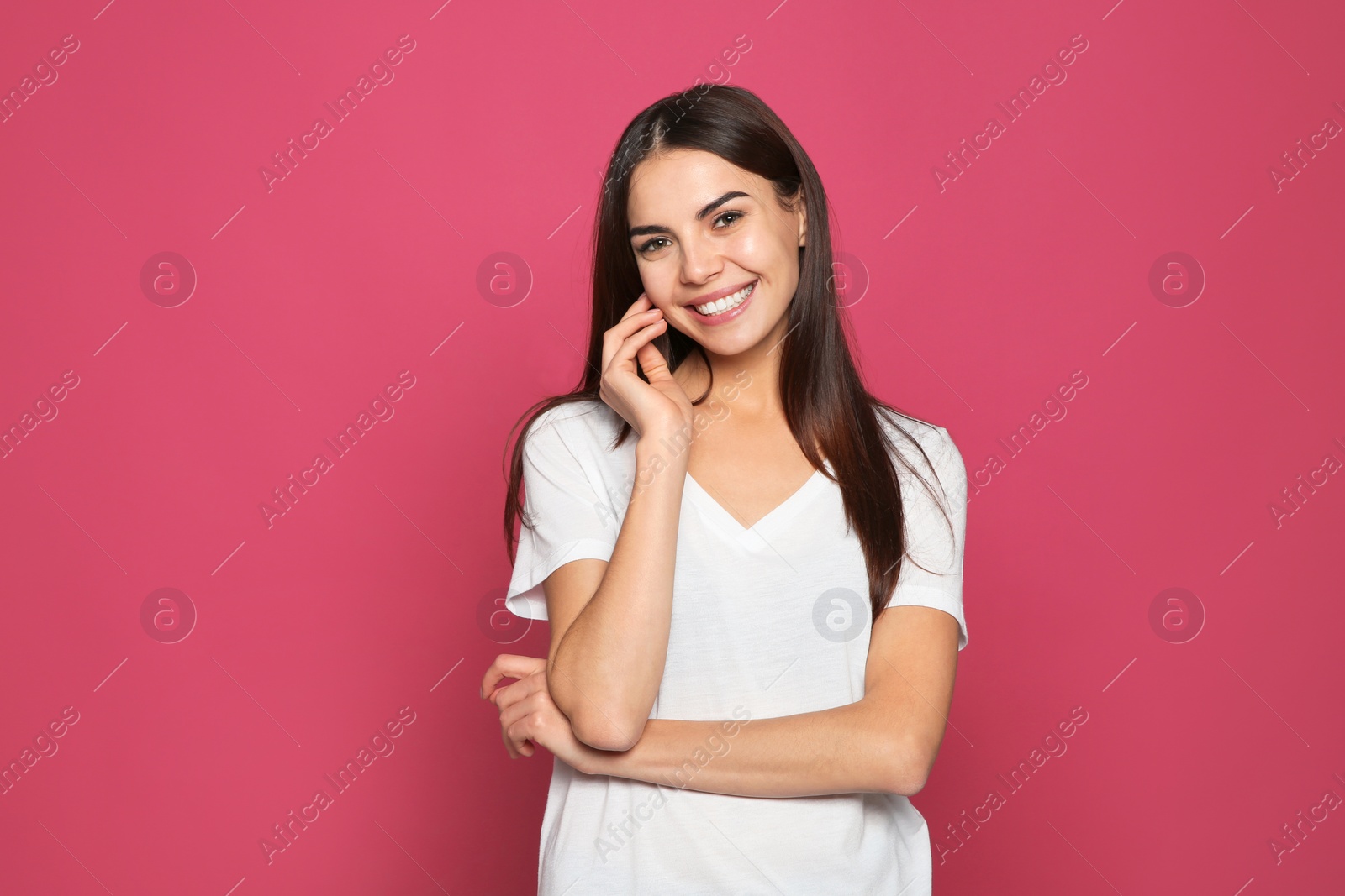 Photo of Portrait of young woman laughing on color background