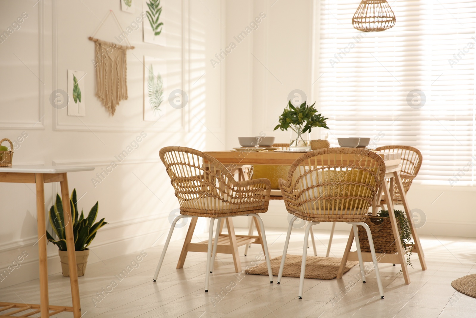 Photo of Stylish wooden dining table and chairs in room. Interior design