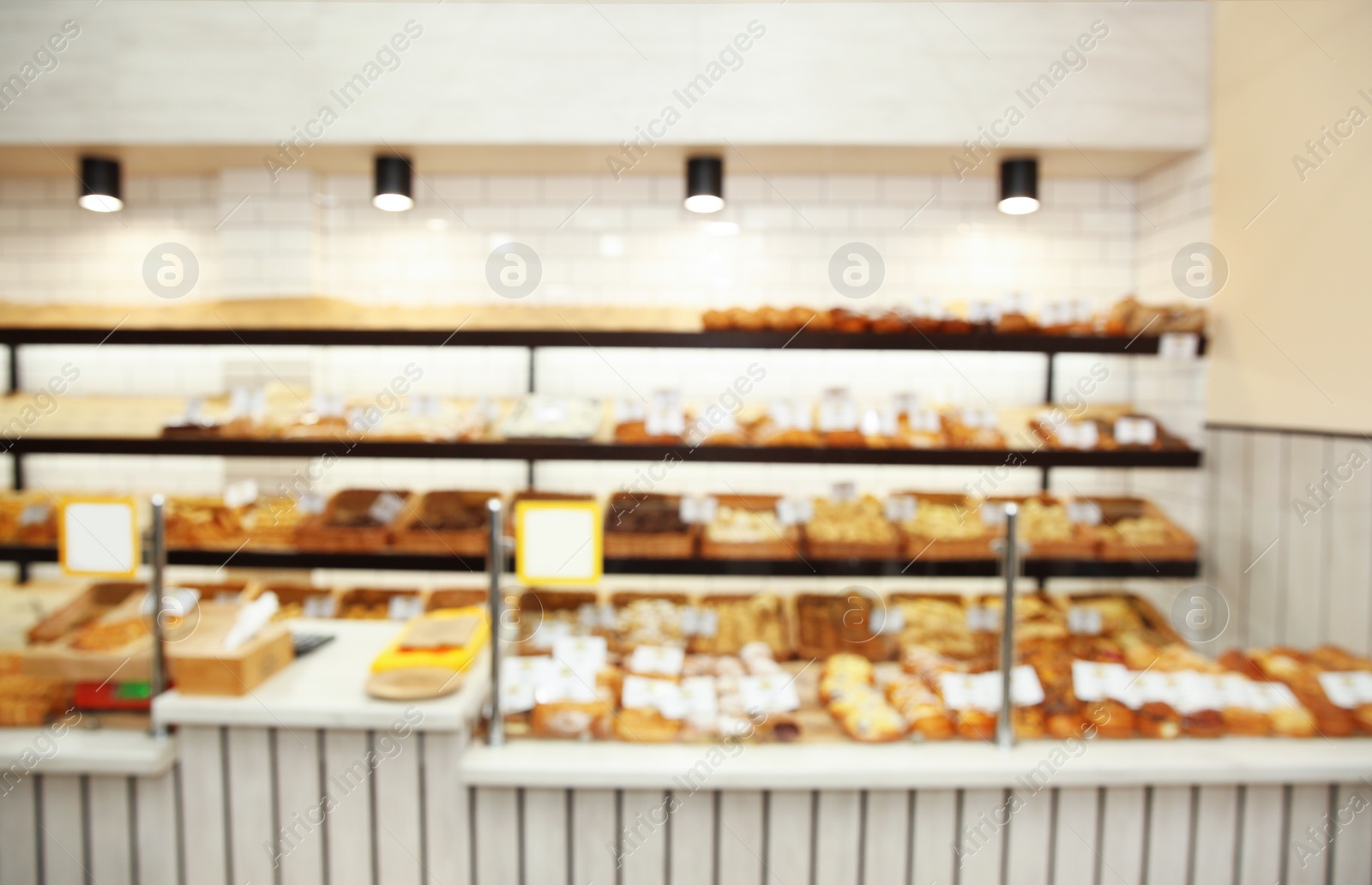 Photo of Blurred view of bakery store with pastries