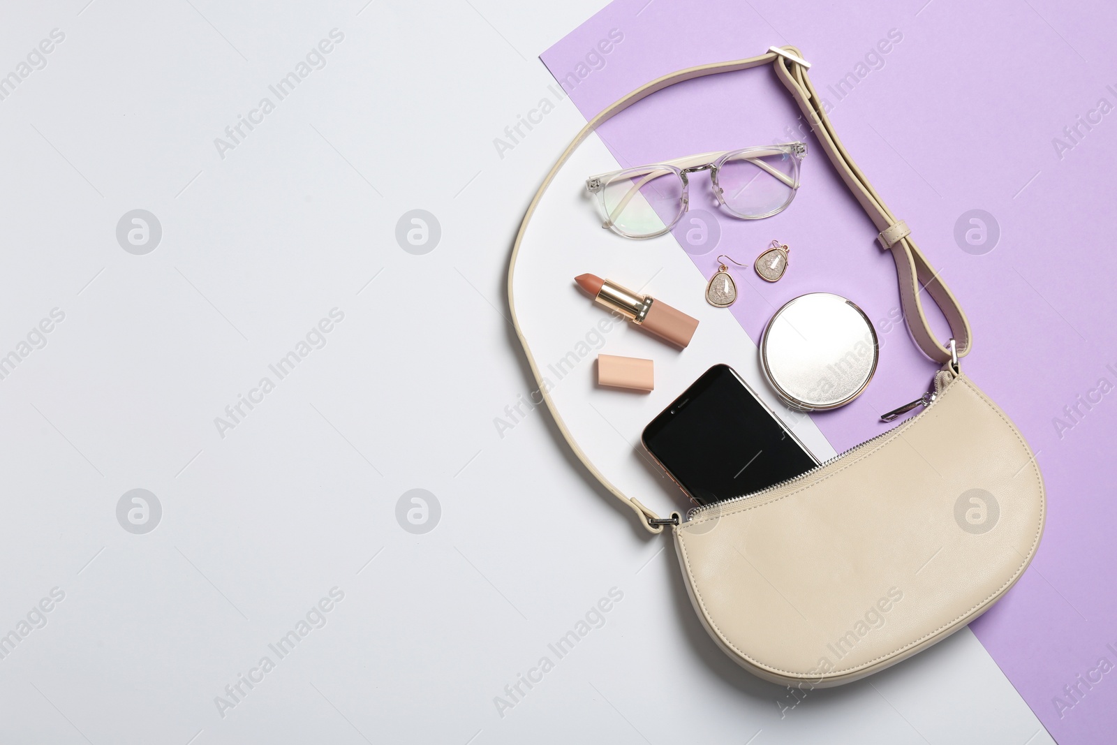 Photo of Stylish women's bag and different stuff on color background, flat lay. Space for text