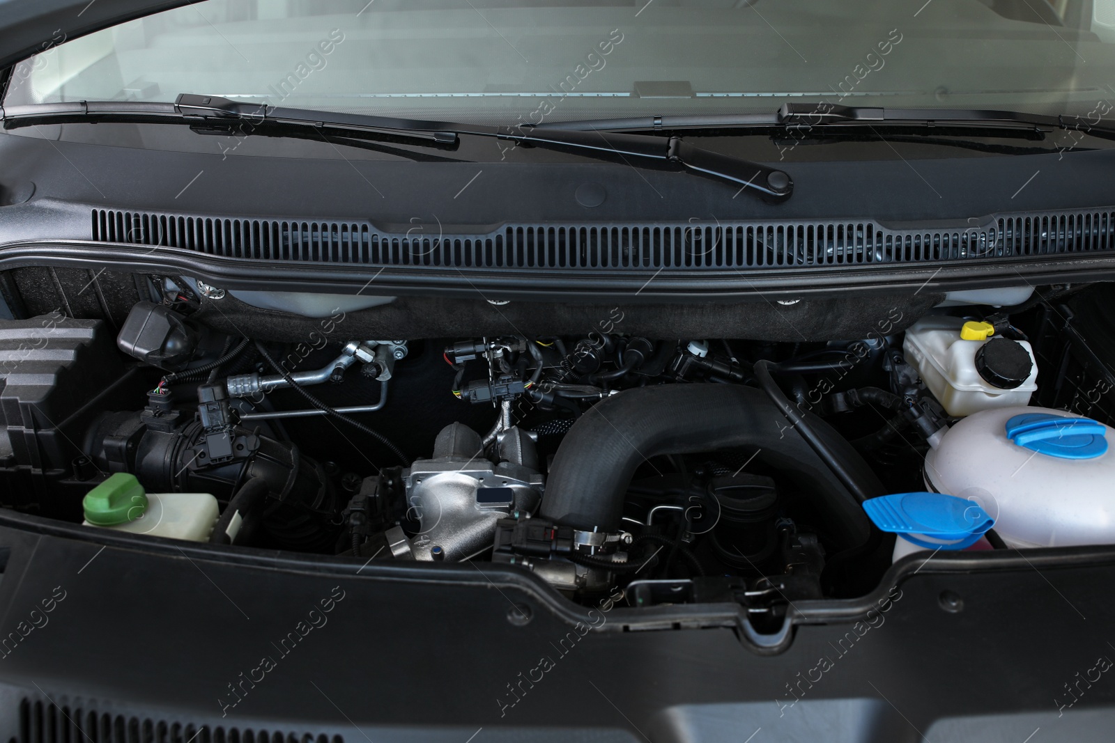 Photo of Closeup view of engine bay in modern auto