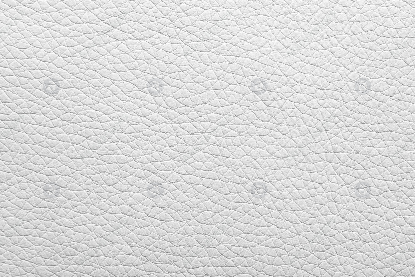 Photo of Texture of light leather as background, closeup