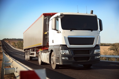 Photo of Beautiful view of asphalt highway with truck. Road trip