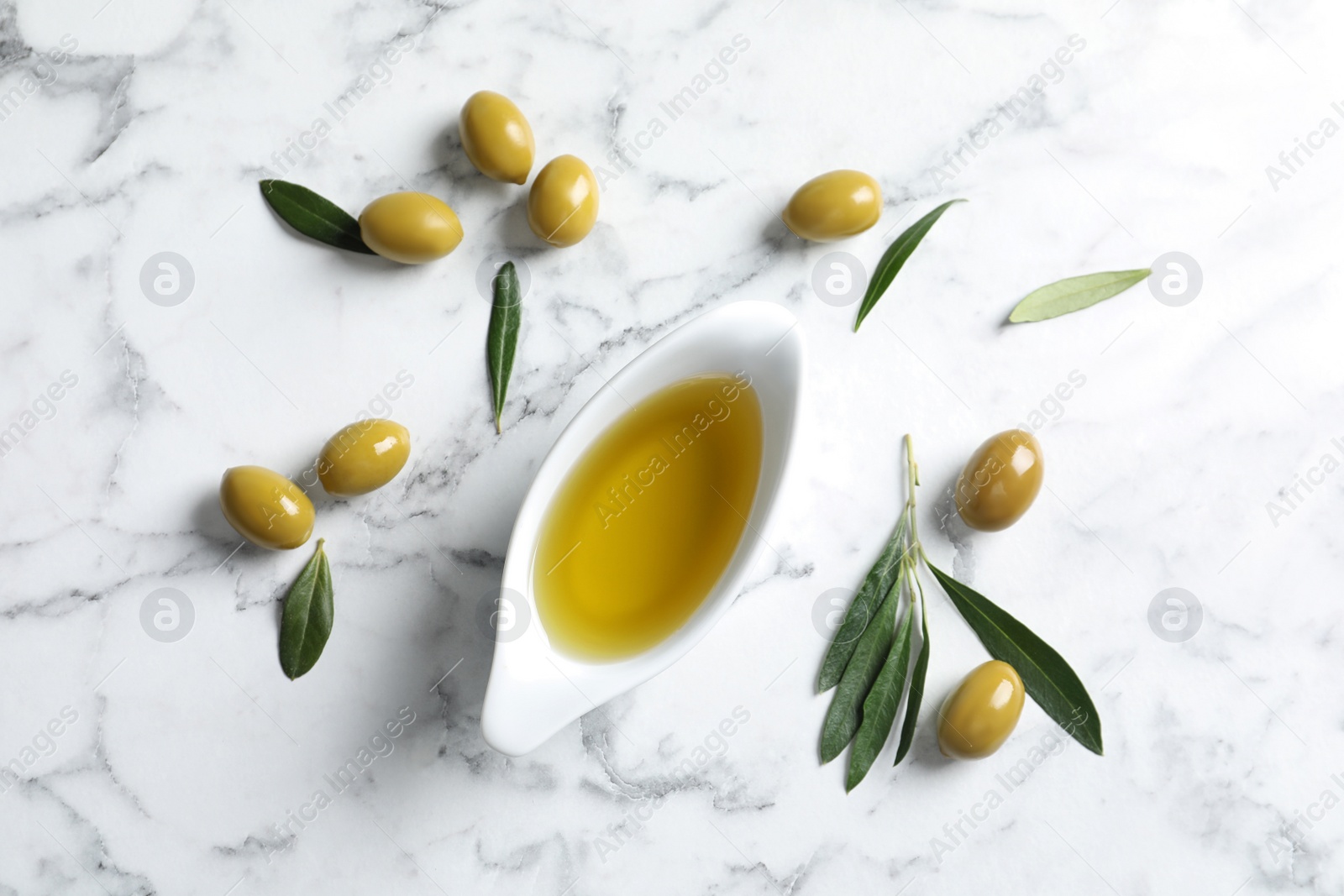 Photo of Flat lay composition with fresh olive oil on marble background