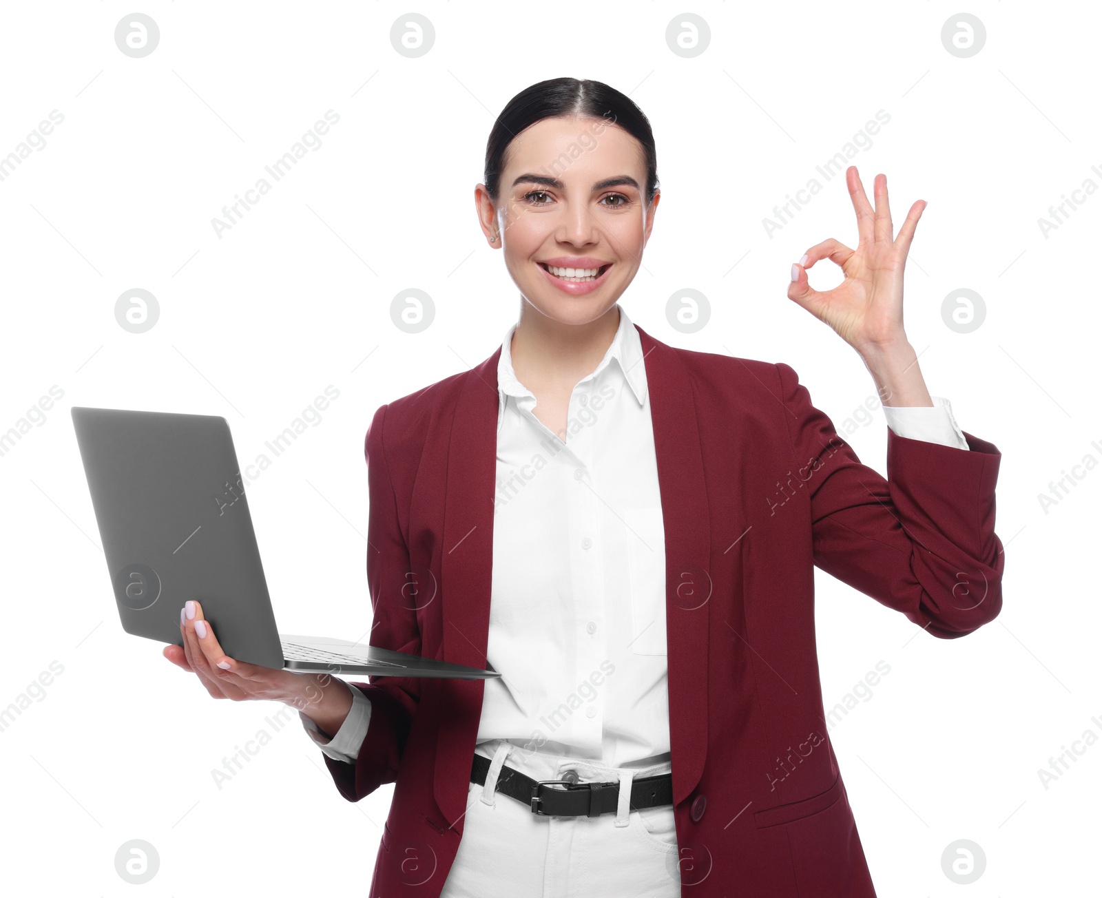 Photo of Happy woman with laptop showing okay gesture on white background