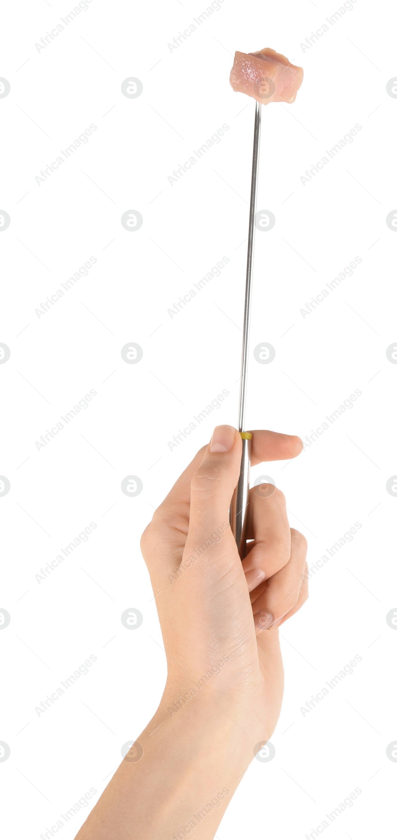 Photo of Woman holding fork with piece of raw meat on white background