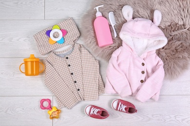 Flat lay composition with stylish child clothes on light background