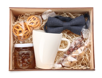 Gift set with cup, bow tie and different products in box on white background, top view. Stylish men's present