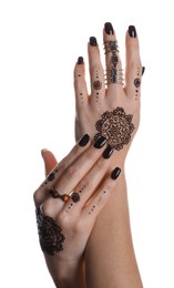 Photo of Woman with henna tattoos on hands against white background, closeup. Traditional mehndi ornament