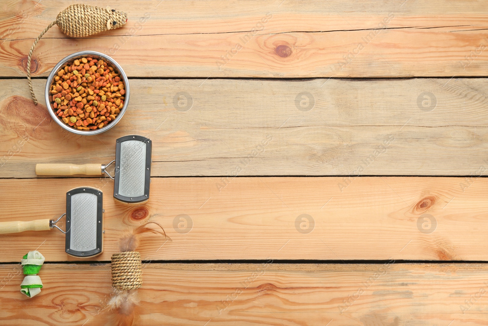 Photo of Flat lay composition with cat accessories and food on wooden background