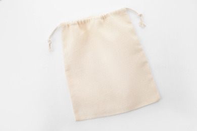 Photo of Empty cotton eco bag isolated on white