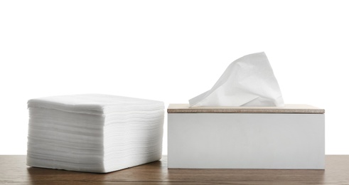 Different clean paper tissues on wooden table