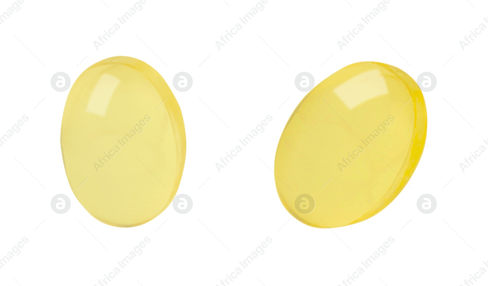 Image of Vitamin pills. Two softgels isolated on white