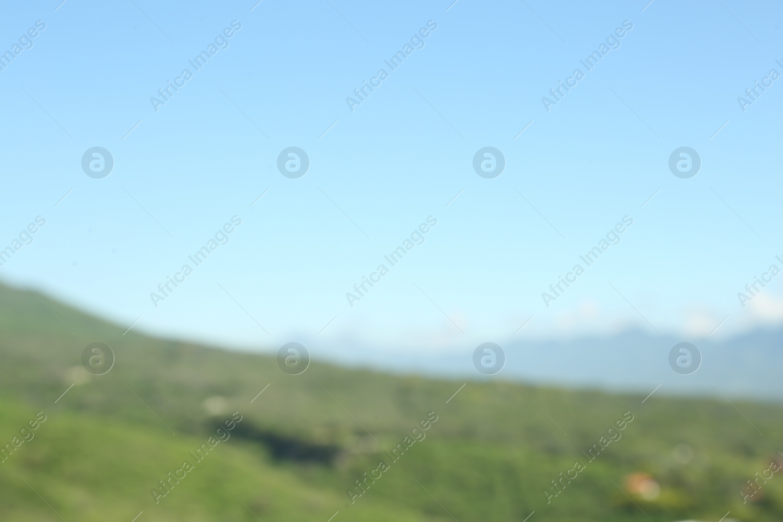 Photo of Blurred view of high mountains on sunny day