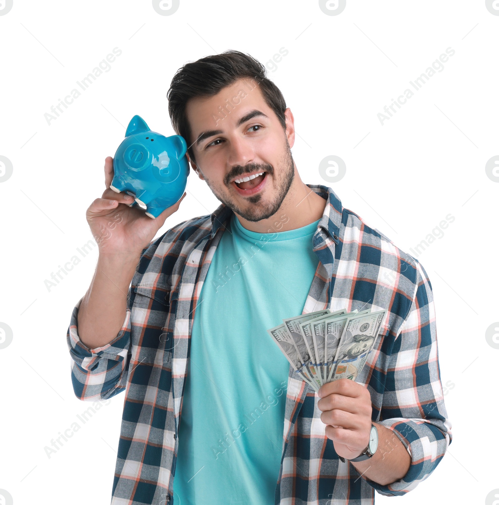 Photo of Handsome young man with dollars and piggy bank on white background