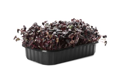 Photo of Fresh radish microgreens in plastic container isolated on white