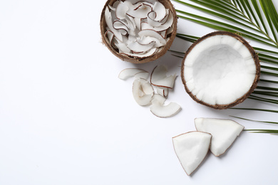 Composition with tasty coconut chips on white background, top view