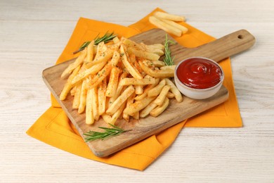 Photo of Delicious french fries served with sauce on white wooden table