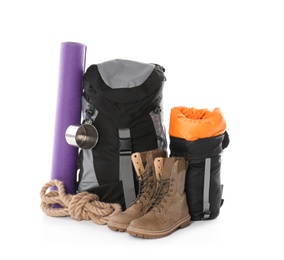 Photo of Set of camping equipment with sleeping bag on white background