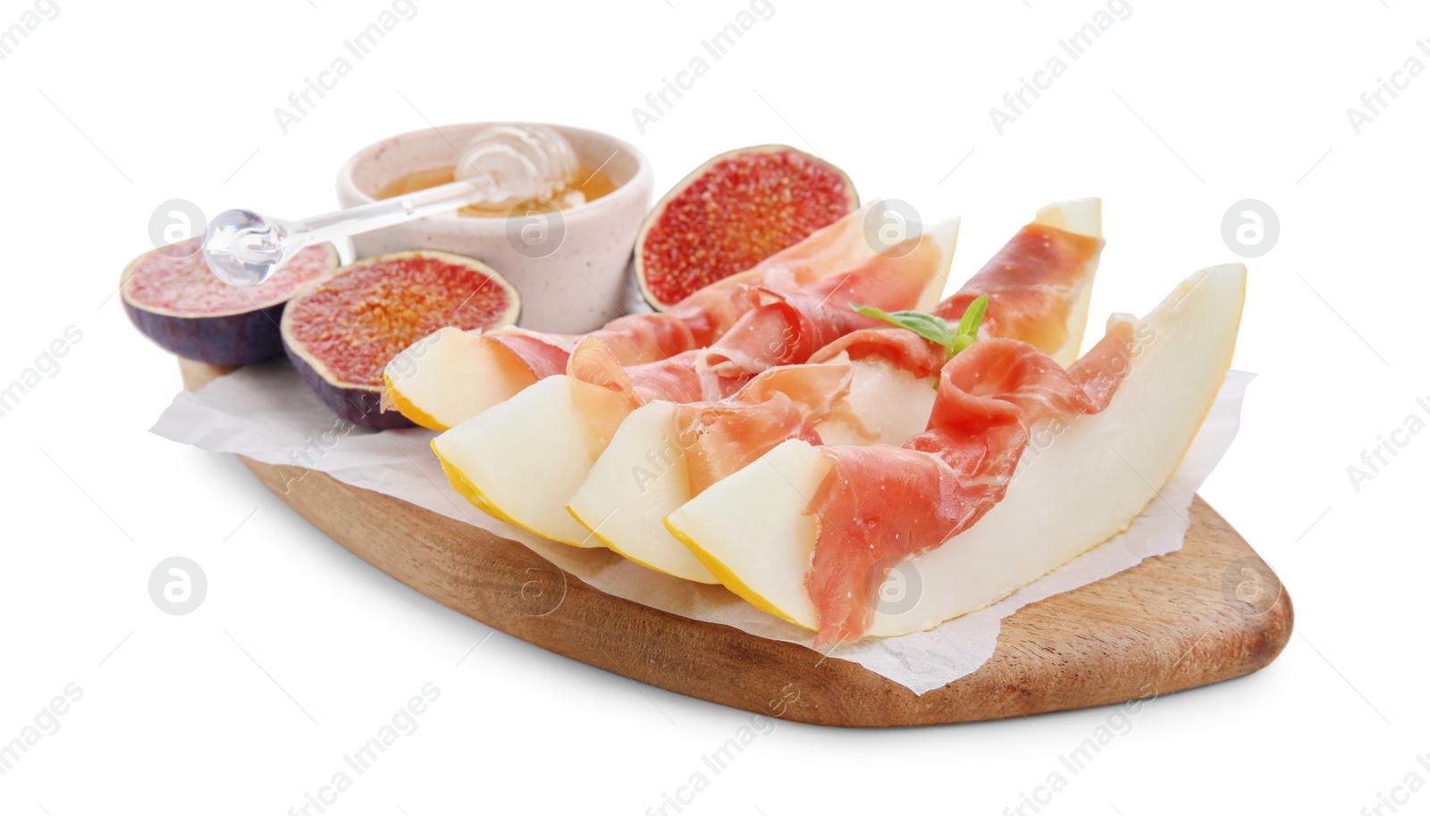 Photo of Wooden board with tasty melon, jamon, figs and honey isolated on white