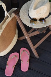 Photo of Stylish bag and other beach accessories outdoors