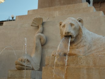 Photo of JESI, ITALY - MAY 17, 2022: Beautiful lion and fish shaped fountains outdoors