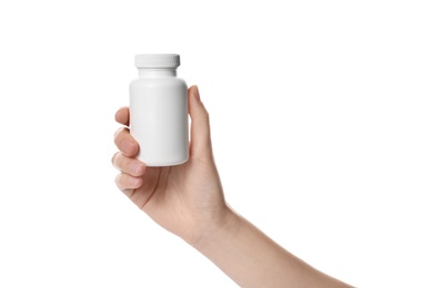 Photo of Woman holding bottle of pills on white background, closeup